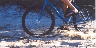 Sand Dragster bicycle powers through a curve in deep sand. bMHR